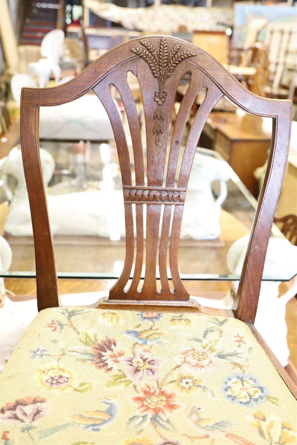 A harlequin set of eight Hepplewhite style mahogany dining chairs with tapestry drop in seats